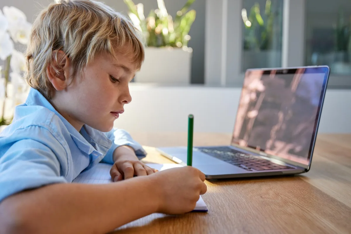 A child writing in a notebook