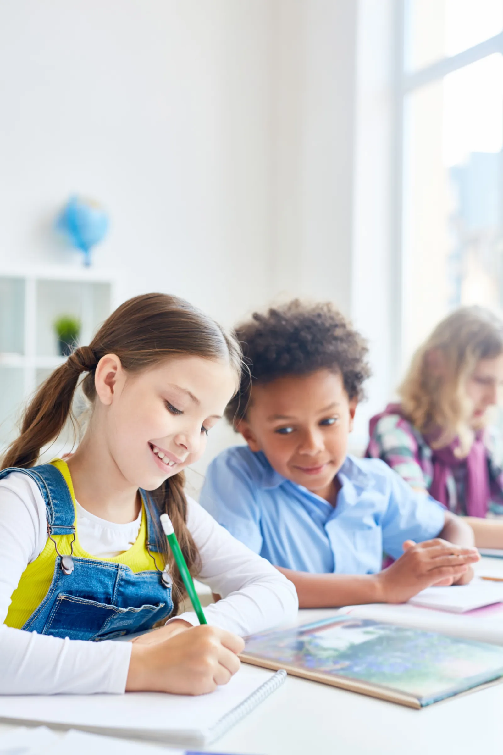 Children writing at their desks