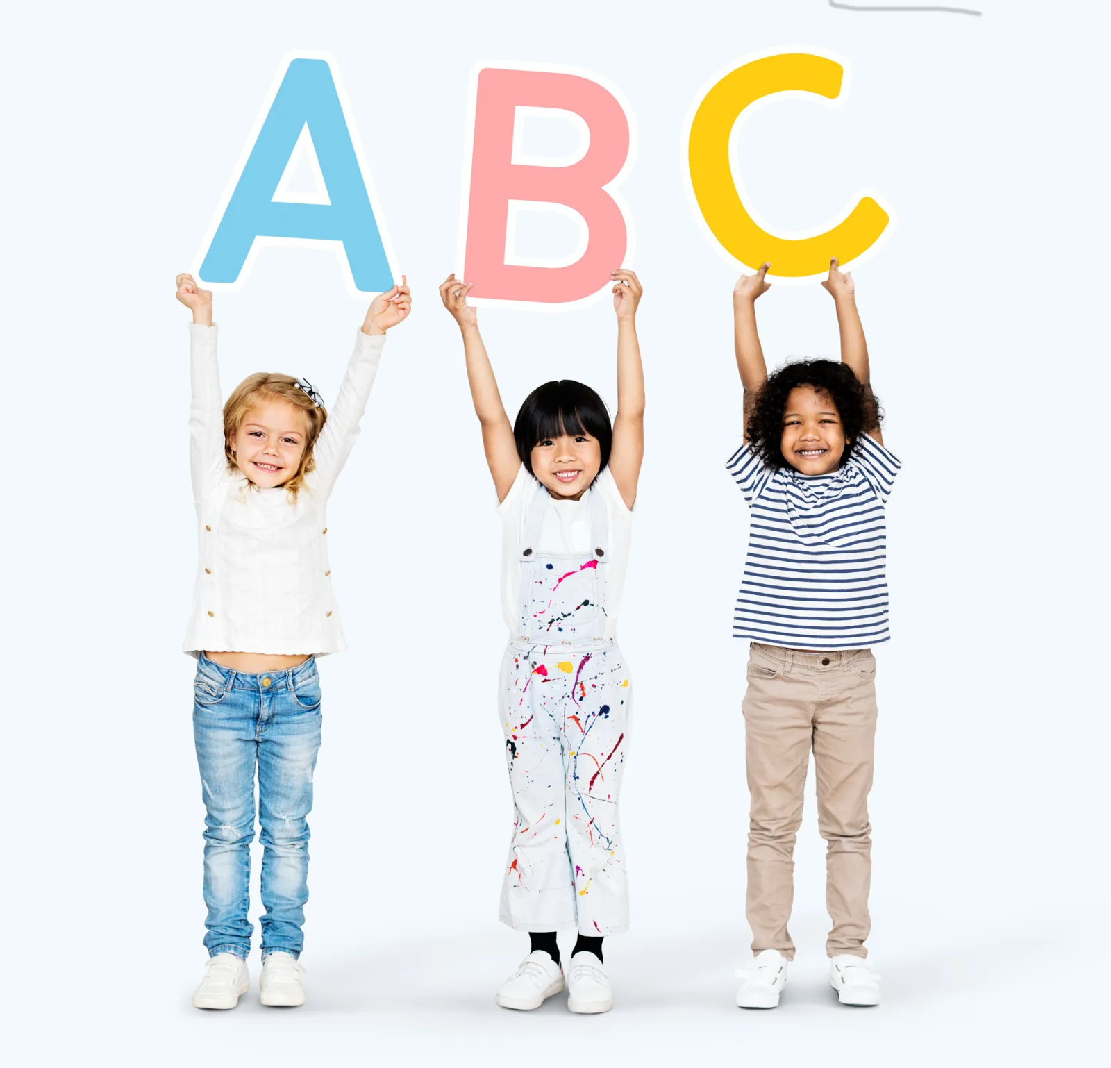 Young children holding the letters A, B and C above their heads
